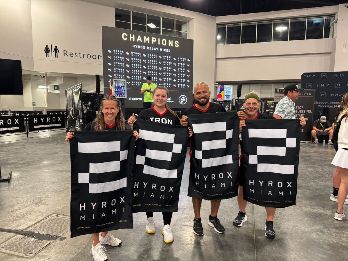 Shred Shed athletes with Hyrox Miami champions banners