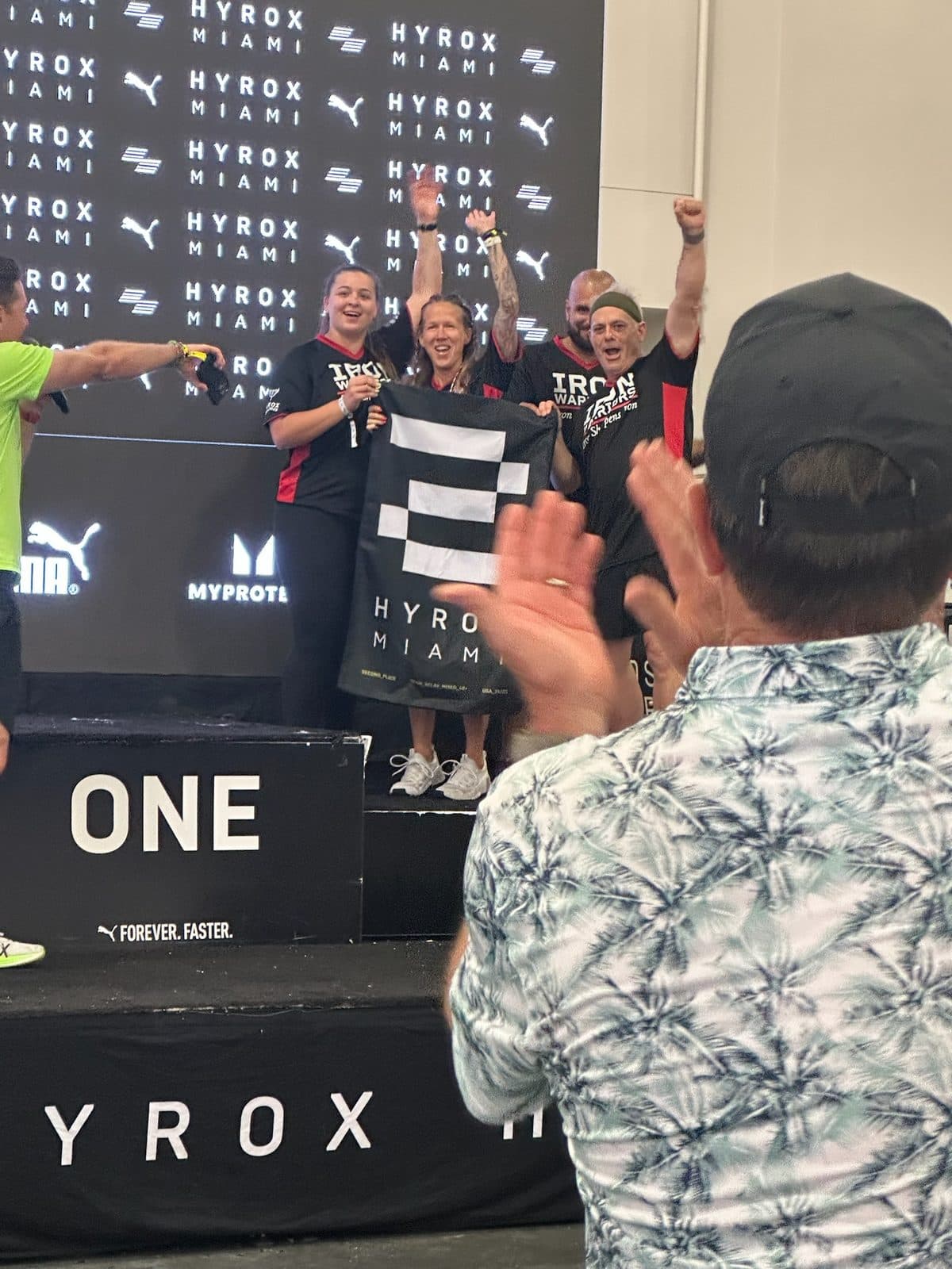 The team celebrating first place on the Hyrox Miami podium