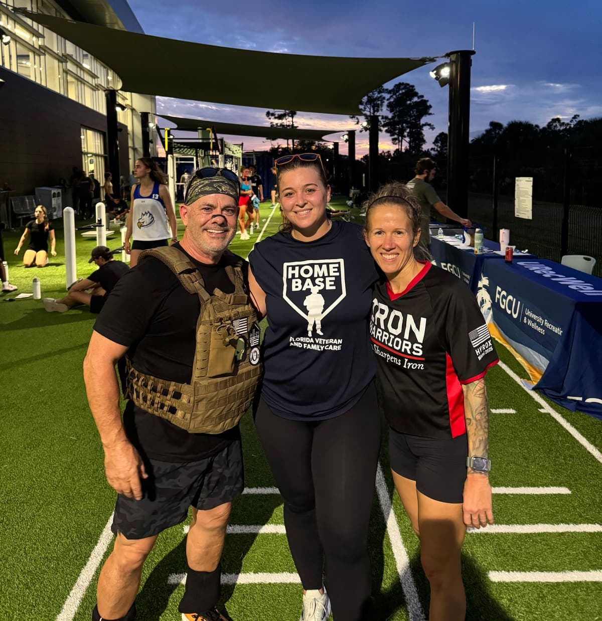 Team training in weighted vests during an evening session
